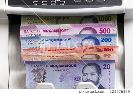 Mozambican metical in the counting machine 123826329