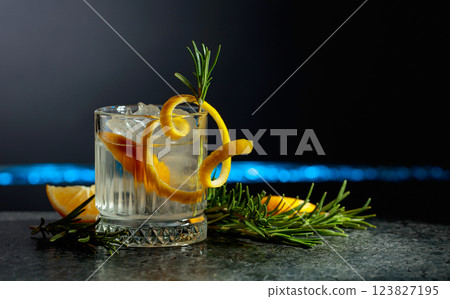 Refreshing gin-tonic cocktail with lemon and rosemary. 123827195