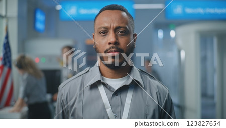 Airport Security Checkpoint: Portrait of Security Officer in Uniform Looking at Camera Airport Security Checkpoint: Portrait of Security Officer in Uniform Looking at Camera 123827654