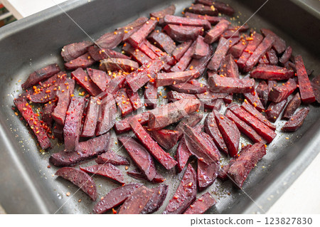 Juicy beetroot slices baked in the oven on a Teflon-coated baking sheet 123827830