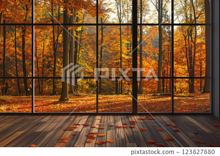 Large window is framing a forest with many trees having orange and yellow leaves typical of the fall season 123827880