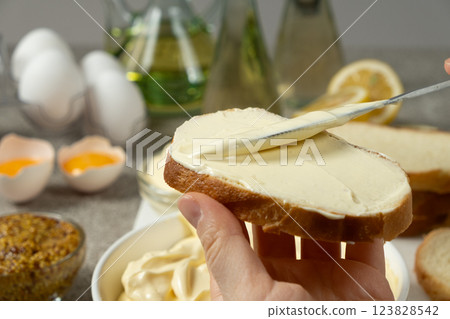 Thick Mayonnaise Spread on Bread Close-Up View 123828542