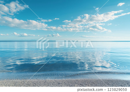 Tranquil beach with calm, crystal clear water under a vast blue sky, reflecting the serene beauty of an untouched paradise 123829050