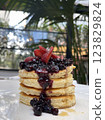 Delicious pancakes with berries, honey or maple syrup . 123829824
