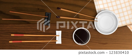 Realistic chopsticks, plate and soy sauce bowl 123830410