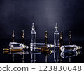 Ampoules with medicine on glossy black background 123830648