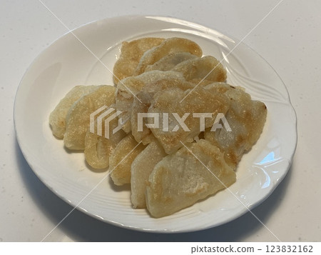 "Fried Moo (Radish) Pancake: A Crispy Korean Delight" "Fried Moo (Radish) Pancake: A Crispy Korean Delight" 123832162