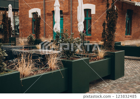 Outdoor cafe seating with tables and chairs 123832485