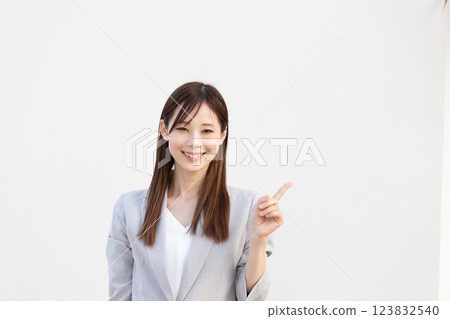 Image of a woman pointing at something (stock photo) Image of a woman pointing at something (stock photo) 123832540
