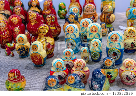 Traditional national Russian souvenirs - Russian matryoshka (wooden nesting dolls) on the counter of the gift shop. Traditional national Russian souvenirs - Russian matryoshka (wooden nesting dolls) on the counter of the gift shop. 123832859