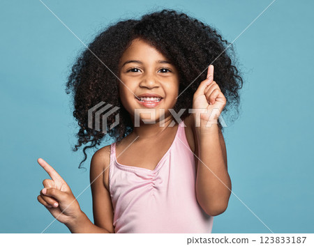 Children, dance and fun with a girl kid dancing in studio on a blue background for freedom or expression. Kids, happy and smile with a cute female child dancer feeling positive or carefree inside Children, dance and fun with a girl kid dancing in studio on a blue background for freedom or expression. Kids, happy and smile with a cute female child dancer feeling positive or carefree inside 123833187