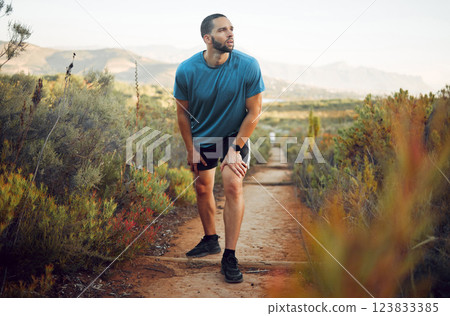 Runner, fitness and tired man on nature park trail for training, exercise and cardio health for a summer marathon. Sport, male athlete and hiking workout while resting and taking break to breathe Runner, fitness and tired man on nature park trail for training, exercise and cardio health for a summer marathon. Sport, male athlete and hiking workout while resting and taking break to breathe 123833385