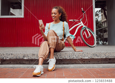 Woman, bike or phone in city travel in Amsterdam for gps location, map or social media search. Smile, happy and relax fashion student or cool model with mobile, eco friendly or environment transport 123833488