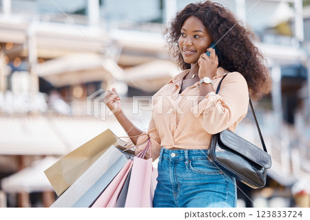 Retail shopping bag, phone call and black woman in city feeling happy with shopping experience. Fashion, sale and retail store purchase of female from Nigeria on 5g mobile, talking and smile outdoors Retail shopping bag, phone call and black woman in city feeling happy with shopping experience. Fashion, sale and retail store purchase of female from Nigeria on 5g mobile, talking and smile outdoors 123833724
