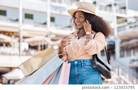 Phone call, black woman and shopping bags of a person from Miami feeling happy about shop experience. Sale, store and retail purchase of a person in the city with mobile technology and smile outdoor 123833795