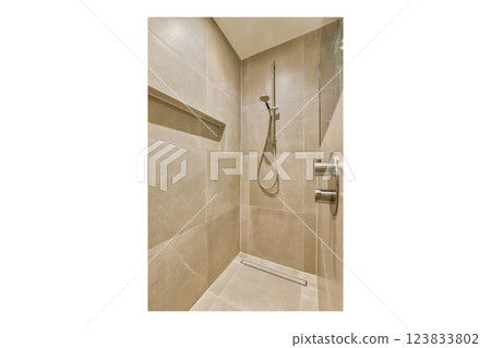 A sleek and stylish shower enclosure featuring contemporary tile designs and minimalistic fixtures. The neutral color palette adds to the soothing ambiance. 123833802