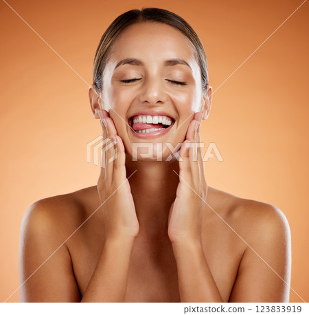 Face, skin and hands, natural beauty and skincare, happy woman in cosmetics advertising. Clean and fresh, glow and facial treatment, body wellness in closed eyes closeup and orange studio background. 123833919