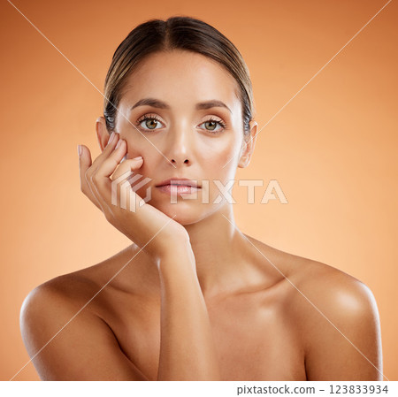 Skincare, beauty and woman with makeup on face against an orange mockup studio background. Portrait of a young, healthy and cosmetic girl model with peace and calm from dermatology skin wellness 123833934
