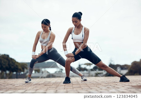 Fitness, city workout and women stretching together before marathon running. Health, wellness and sports, motivation to exercise with dynamic or static flexibility and balance performance training. 123834045
