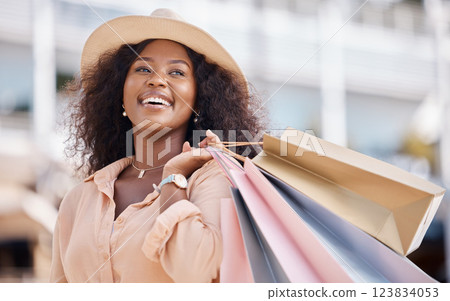 Shopping bag, happy black woman and travel customer smile for discount sales, thinking of luxury fashion choice and market in summer. Wealthy, rich and smile consumer on vacation in Ibiza Spain city 123834053