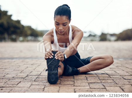 Fitness, sports and woman stretching legs in warm up to start training, exercise and cardio workout in Lisbon. Runner, Athlete and flexible girl holding running shoes for a healthy hamstring stretch 123834056