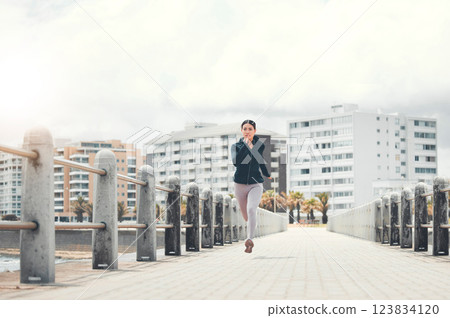 Sports, fitness and woman running on sidewalk with speed, energy and determination outdoors for exercise in Los Angeles. Girl, wellness and healthy runner sprinting for cardio training and workout 123834120