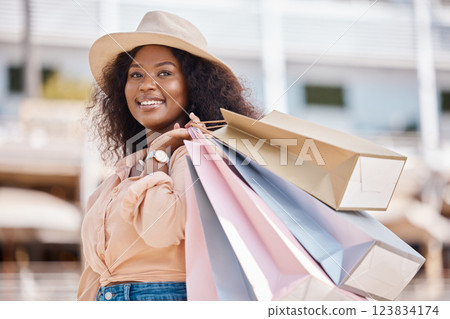 Black woman, retail shopping bag and city customer buying sales, luxury fashion brands and summer market product choice from Brazil mall store. Style, happy and rich young consumer thinking in street Black woman, retail shopping bag and city customer buying sales, luxury fashion brands and summer market product choice from Brazil mall store. Style, happy and rich young consumer thinking in street 123834174