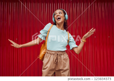Happy woman streaming music, singing and hip hop dance on stage with headphones. Young musical performer, fun and energy in trendy fashion .....broadway.solo act.dancing.listen to music.hip hop rmb Happy woman streaming music, singing and hip hop dance on stage with headphones. Young musical performer, fun and energy in trendy fashion .....broadway.solo act.dancing.listen to music.hip hop rmb 123834373