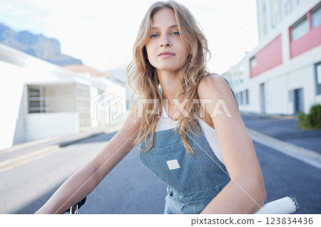 Girl, fashion and gen z in the street in city, sitting on the road in trendy outfit. Portrait of creative, inspiration and model young student in town. Beauty, skin and design in urban town 123834436