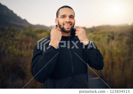Happy man, nature and fitness training while hiking for freedom, health and wellness in mountains with exercise. Portrait and face of male running with hoodie fashion for a calm and healthy workout 123834515