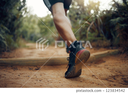 Hiking shoes, nature park trail running and fitness runner on a dirt walking road outdoor. Training, exercise and sport man on cardio, healthy and strong workout of an athlete doing morning sports 123834542