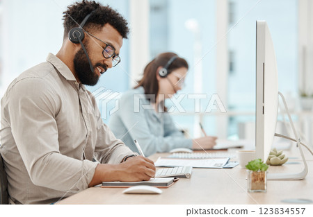 Customer support, writing and businessman at computer in call center office for telemarketing, consulting and phone call. Communication, contact and sales with employee and kpi or crm with notebook Customer support, writing and businessman at computer in call center office for telemarketing, consulting and phone call. Communication, contact and sales with employee and kpi or crm with notebook 123834557