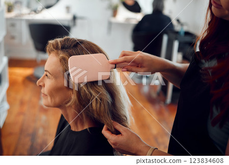 Beauty salon, hair care and brush for woman customer, cosmetic change and fashion after wash, haircut and dry in barbershop. Professional beautician stylist consulting client hairstyle in hairdresser 123834608