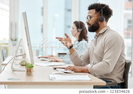 Black man, customer support service office and working for online call center internet telemarketing business. Crm consultant at desk, helping client and consulting computer software for advice Black man, customer support service office and working for online call center internet telemarketing business. Crm consultant at desk, helping client and consulting computer software for advice 123834626
