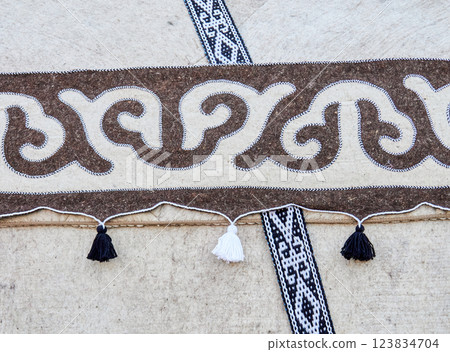 Fragment of Kyrgyz national ornament on a felt yurt 123834704