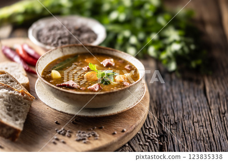 Lentil stew or soup with smoked pork meat, traditional Slovak or Czechv food 123835338