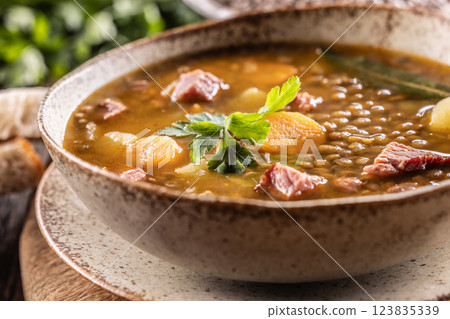 Lentil stew or soup with smoked pork meat, traditional Slovak or Czechv food 123835339