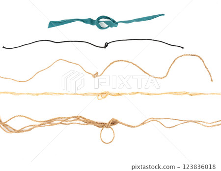 Twine rope piece isolated, jute loop fragment, beige packaging cord knots, old natural line cable 123836018