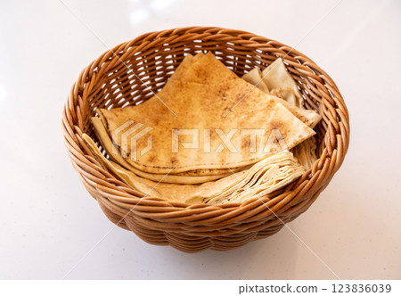 Traditional flatbread, lavash in basket, wheaten pita flat bread or flatbread also known as pita bread 123836039