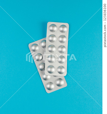Pill Blister on Color Background, Silver Medicine Capsule Package, Drugs Packaging, Pill Pack Pill Blister on Color Background, Silver Medicine Capsule Package, Drugs Packaging, Pill Pack 123836100