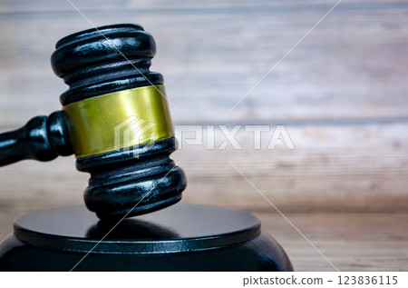 Close up view of lawyer gavel or hammer with customizable space for text, message or ideas. Law and copy space concept 123836115