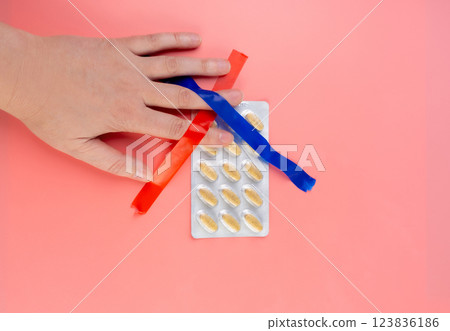 Crossed Out Pill Blister on Pink Background, Silver Medicine Package, Overdose Concept, Opioid 123836186