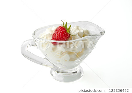 sweet red raspberries with cream in a gravy boat isolated on white background sweet red raspberries with cream in a gravy boat isolated on white background 123836432
