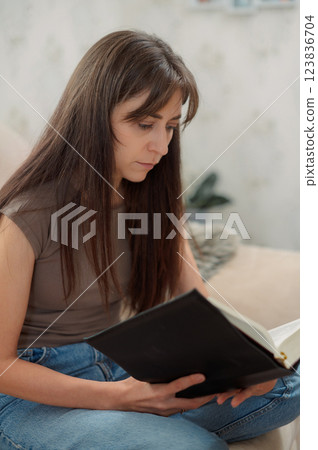 Bible, woman study and writing, notes on religion at desk in home, Christian faith and knowledge of God. Reading, hope and girl holy book, learning gospel inspiration prayer. Bible, woman study and writing, notes on religion at desk in home, Christian faith and knowledge of God. Reading, hope and girl holy book, learning gospel inspiration prayer. 123836704