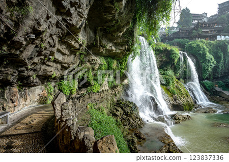 Beautiful waterfall and ancient village at Furong ancient town in Hunan, China. 123837336