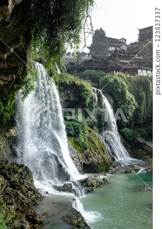Beautiful waterfall and ancient village at Furong ancient town in Hunan, China. 123837337