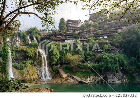 Beautiful waterfall and ancient village at Furong ancient town in Hunan, China. 123837338
