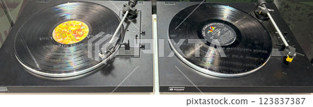 Vintage Vinyl Records Spinning on Turntables in a Music Studio on a Saturday Afternoon Vintage Vinyl Records Spinning on Turntables in a Music Studio on a Saturday Afternoon 123837387