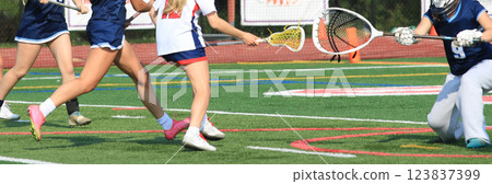Girls Lacrosse Player taking a shot on goal 123837399