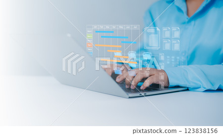 Project management tool and work schedule concept, Planning software, Businessman use laptop to manager working projects and update task with gantt chart schedule to Business plan and progress. 123838156